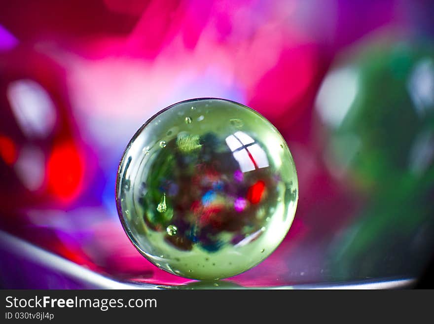 Marbles on colorfull blurred background