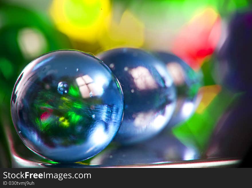 Marbles on colorfull blurred background