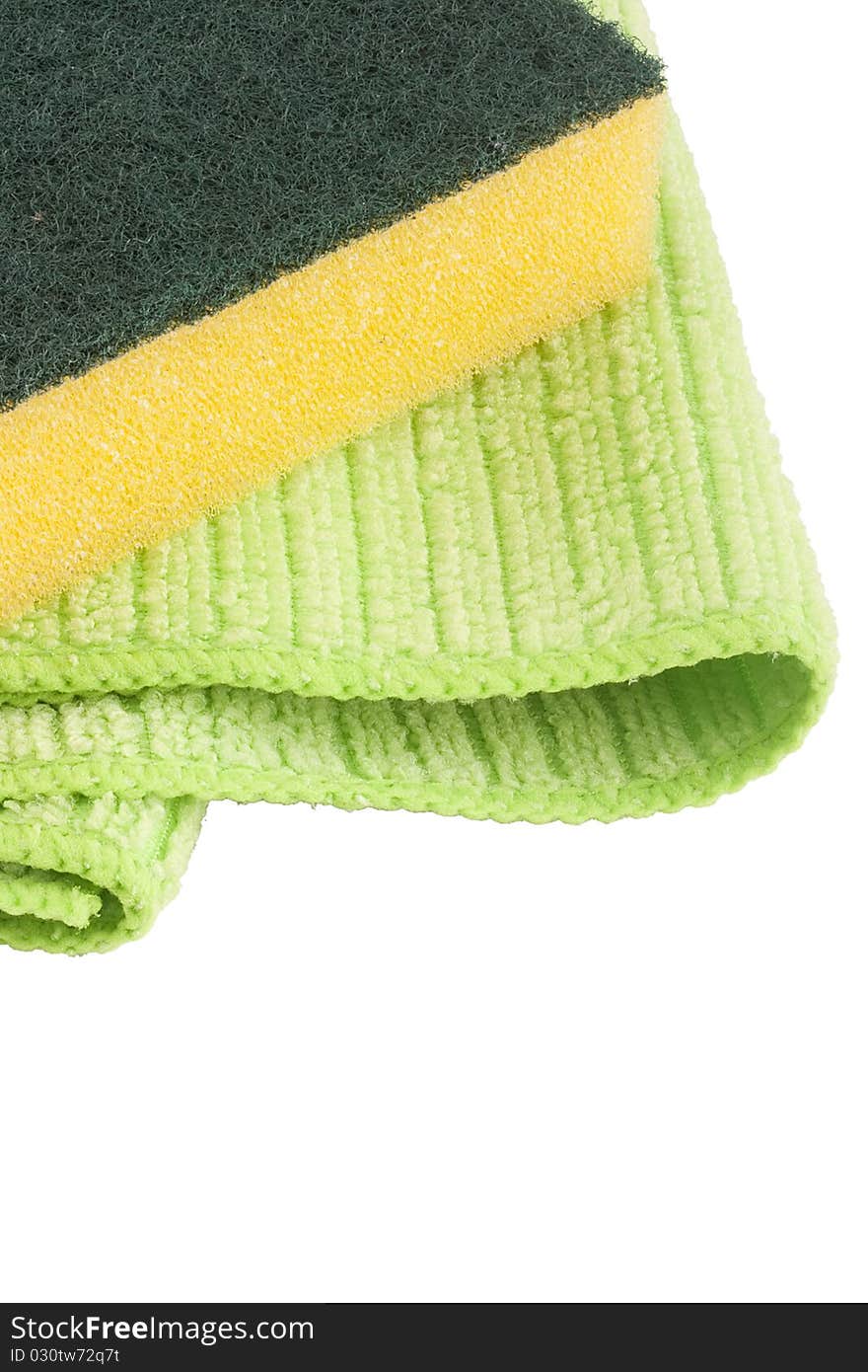 Green cloth fabric with synthetic yellow sponge for cleaning the room.