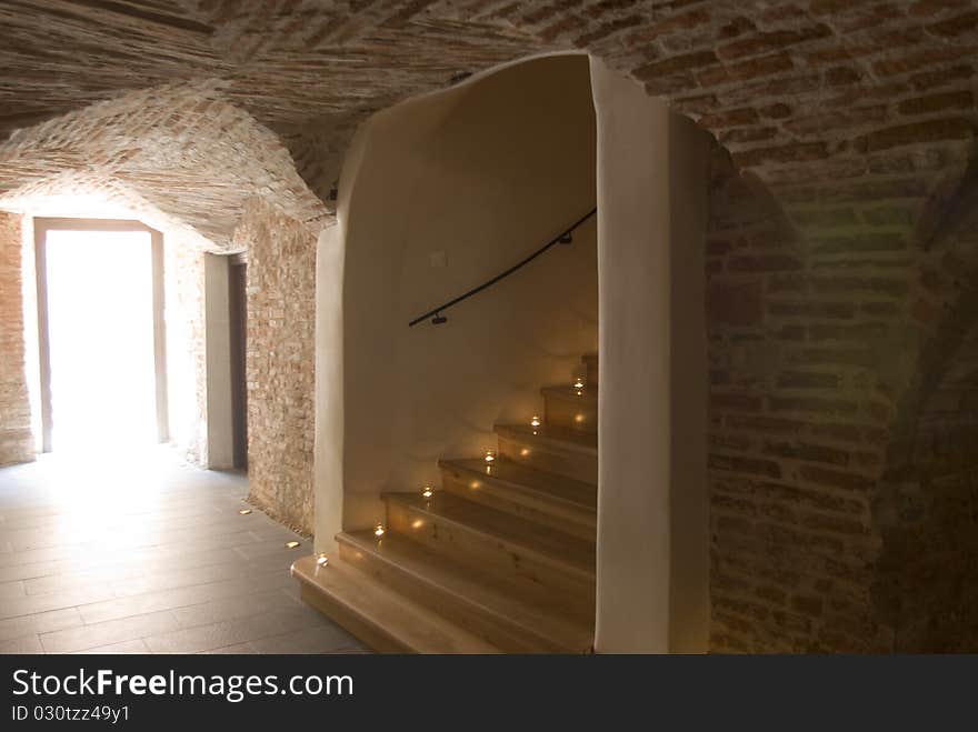 Stairs in an old building leading into the cellar.