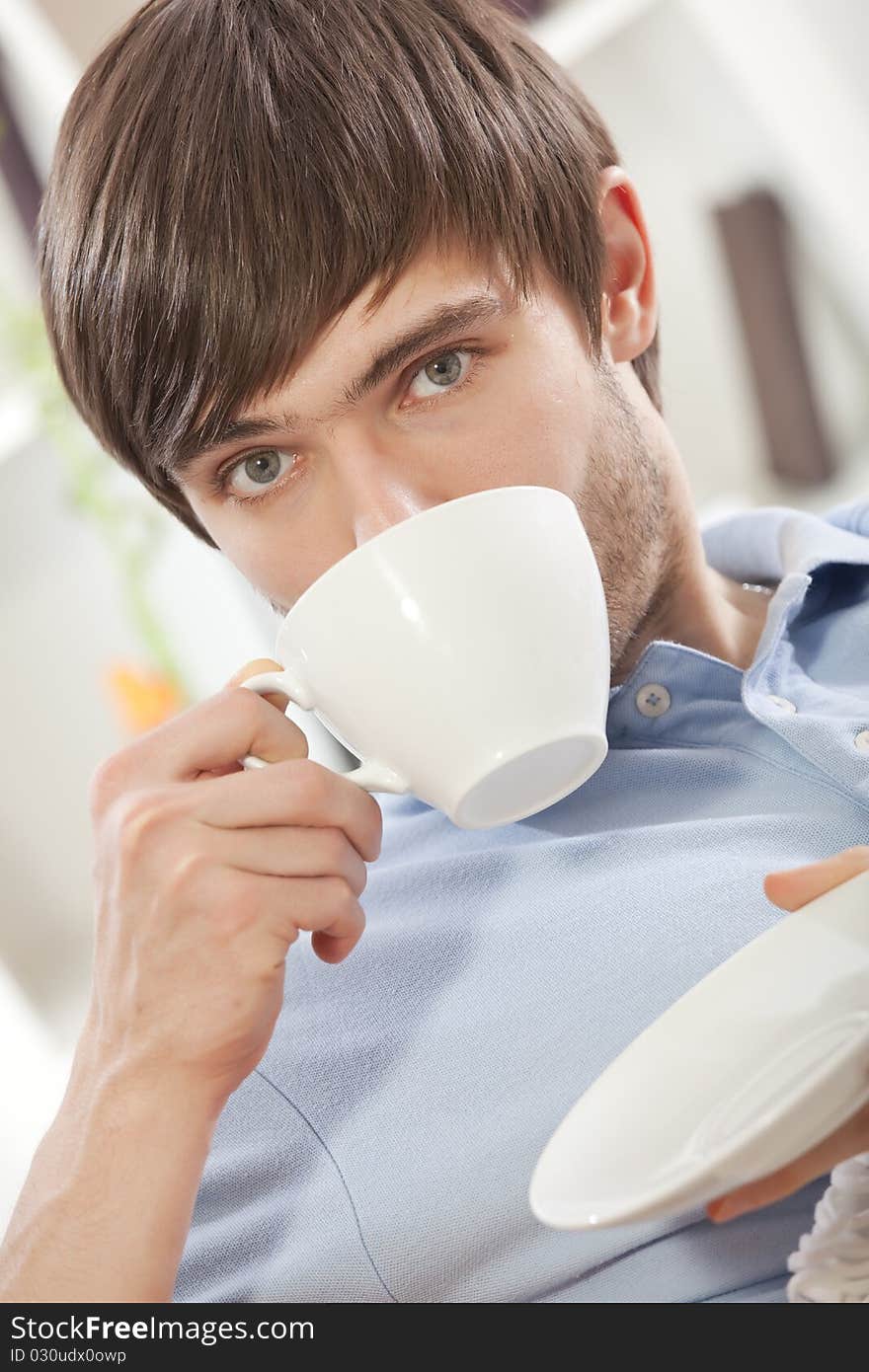 Man drinking tea at home