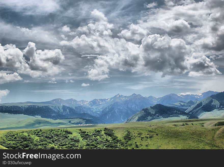 Clouds over the mountains. Cloudy morning