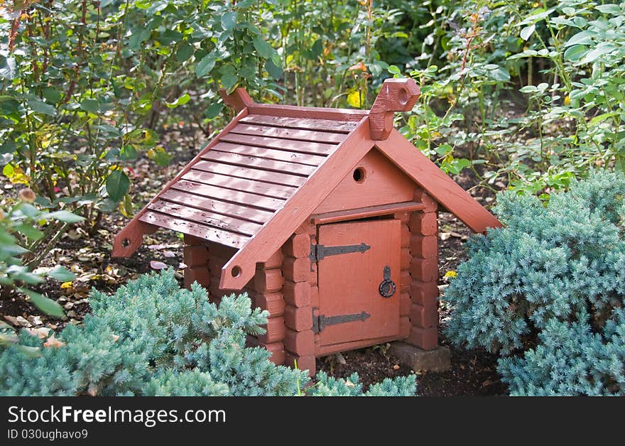 Small wooden small house in a garden. Small wooden small house in a garden