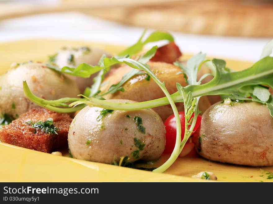 Button mushrooms with fried bread and arugula. Button mushrooms with fried bread and arugula