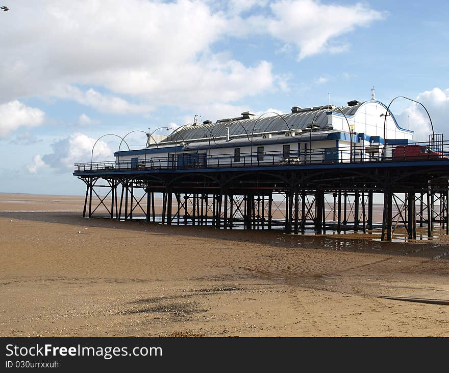 English Pier standind on stilts at low tide