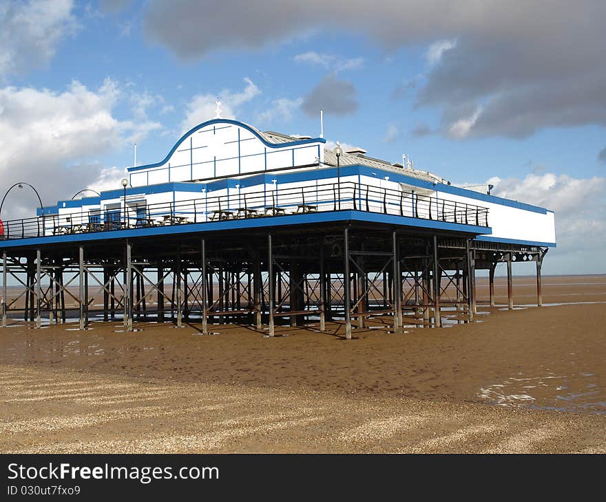 English Pier standind on stilts at low tide