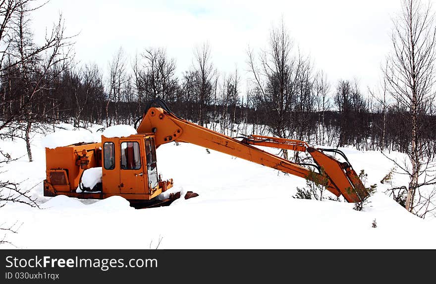 An old excavator in the forest