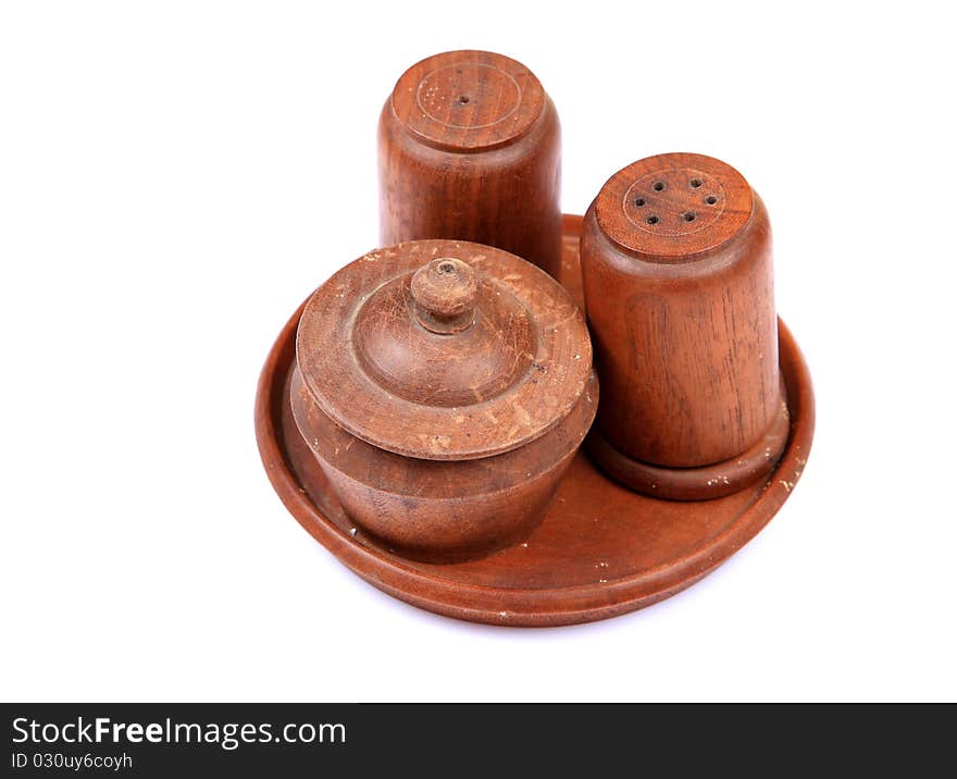 Wooden salt and pepper containers isolated on white background.