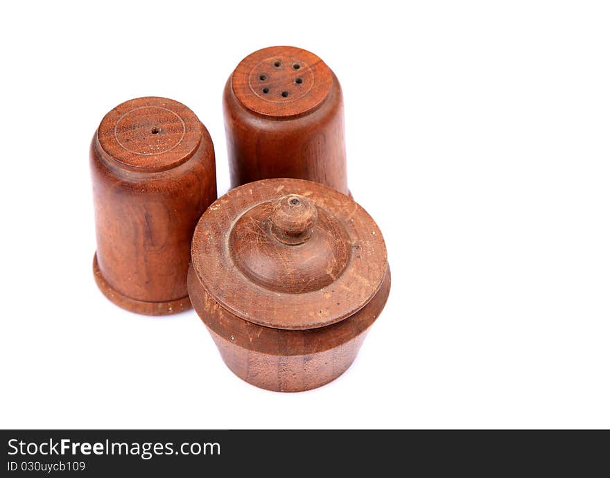 Wooden salt and pepper containers isolated on white background.