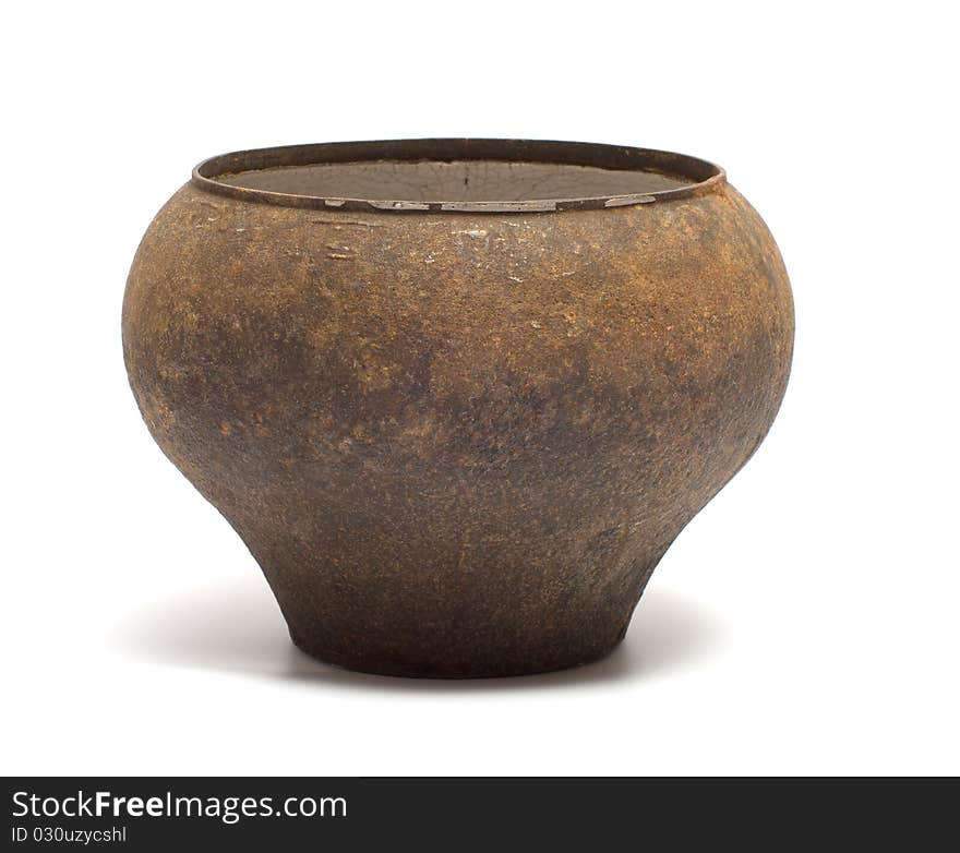 The old iron rusty pot on a white background. The old iron rusty pot on a white background.