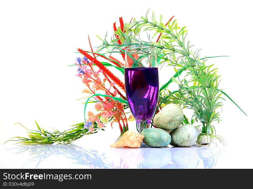 Mint mocktail glass with natural plants on white background.