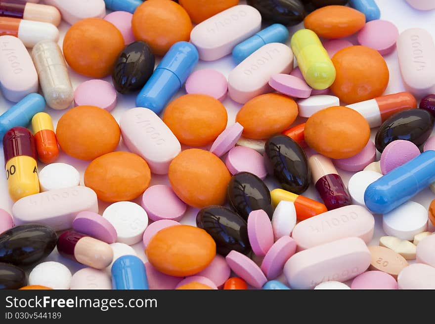 Group of multicolor tablets and capsules