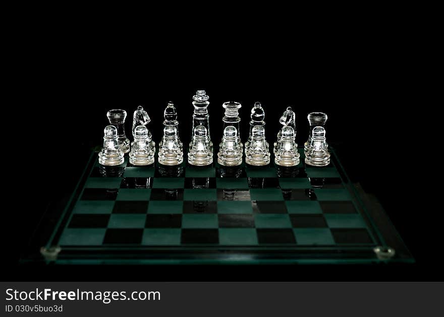 Crystal chess pieces on black background. Crystal chess pieces on black background.