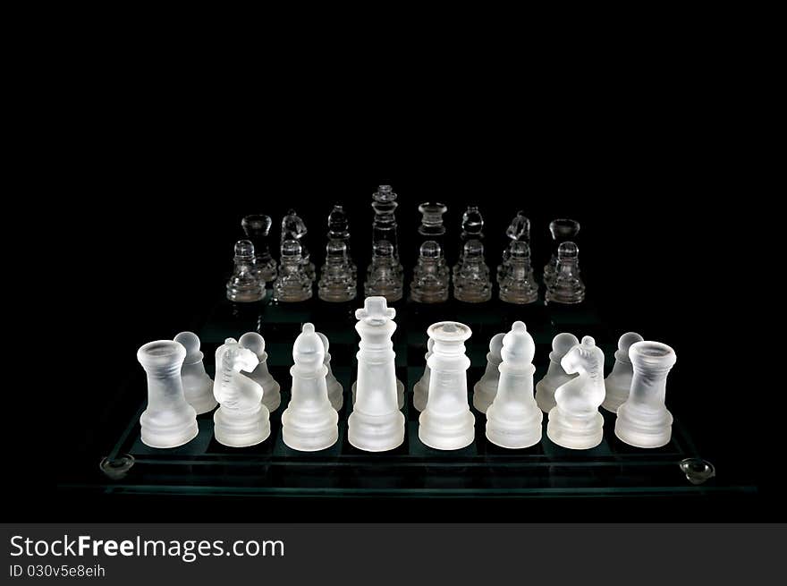 Crystal chess pieces on black background. Crystal chess pieces on black background.