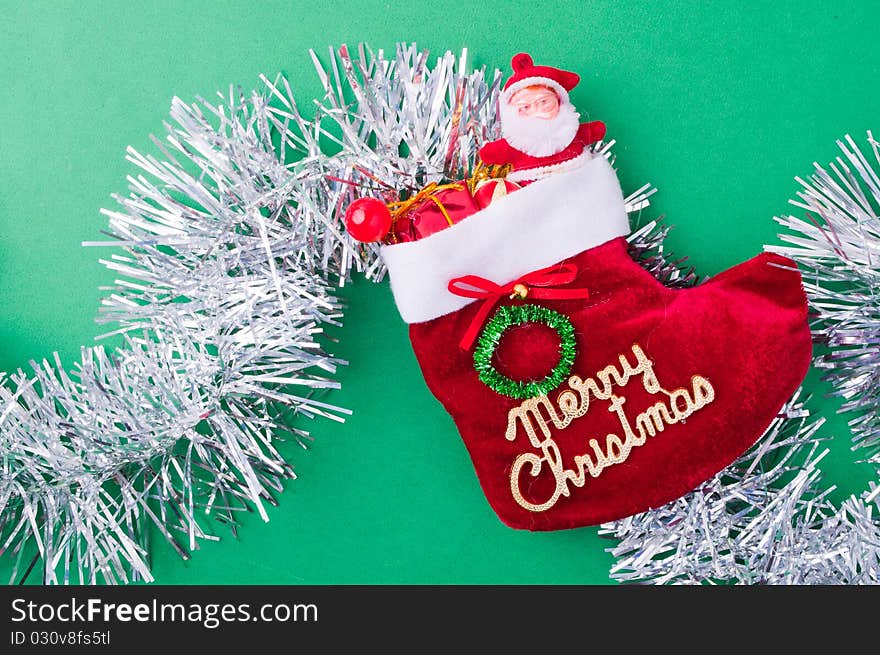 Christmas decoration objects on light green background. Christmas decoration objects on light green background