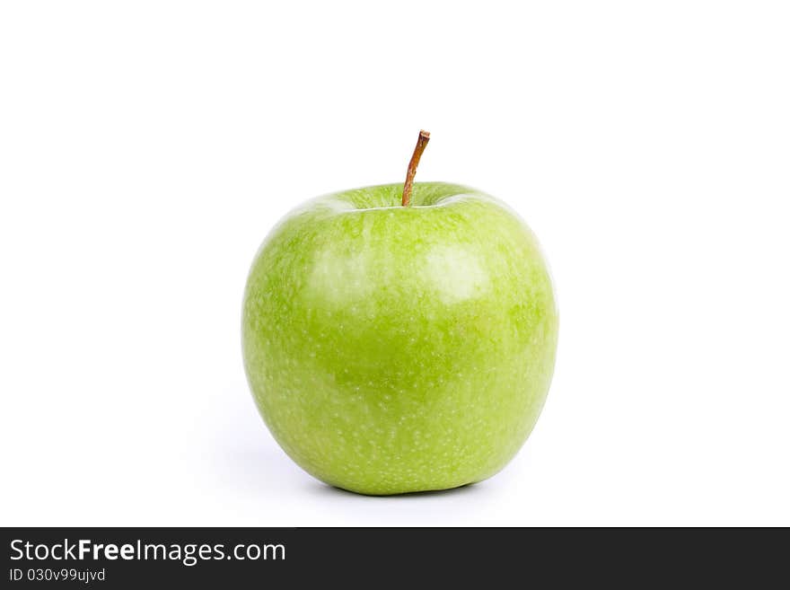 Green apple on white, closed-up