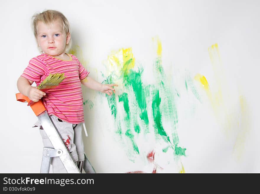 Cute child painting over white