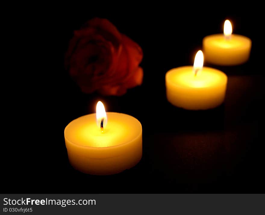 Candles flaming in the dark