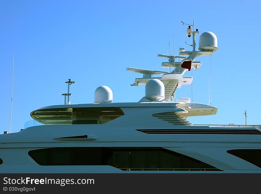 Part of big cruise ship under blue sky