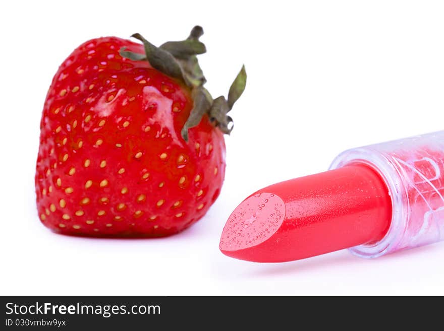 Strawberry and lipstick, closed-up on white