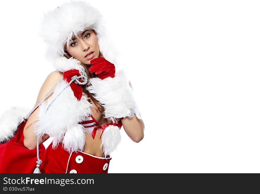 Studio portrait of a young brunette woman dressed as Santa