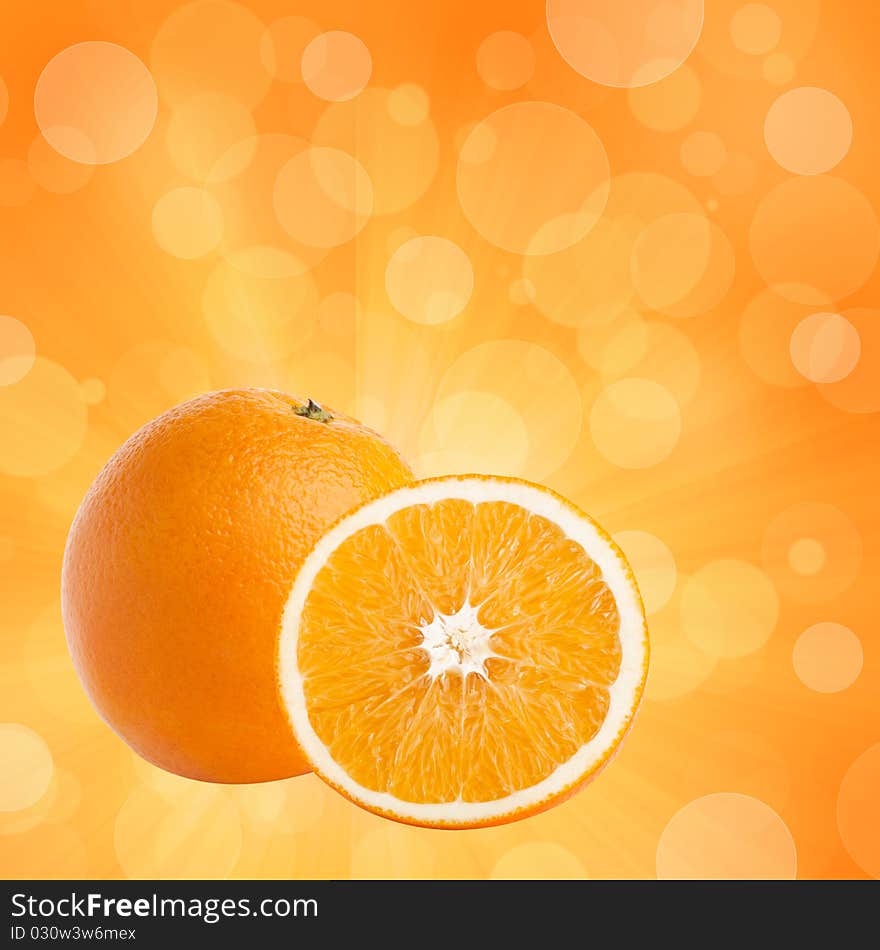 One and half oranges on abstract bokeh background