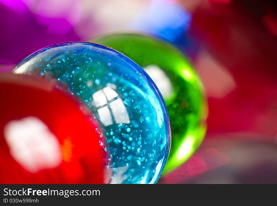 Marbles on colorfull blurred background