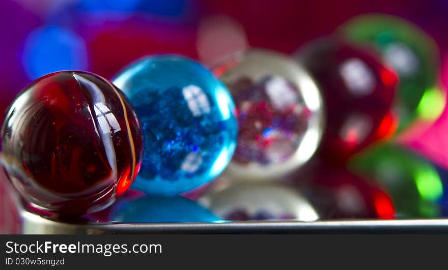 Marbles on colorfull blurred background