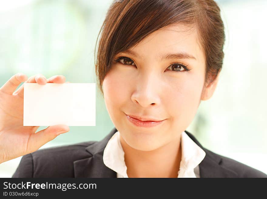 Portrait of confident businesswoman with business card. Portrait of confident businesswoman with business card