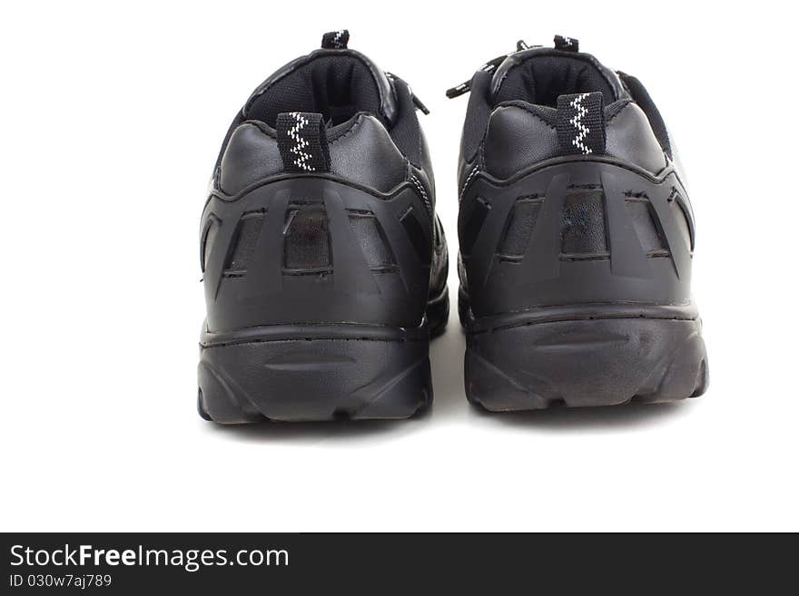 Series. Black leather shoes on a white background