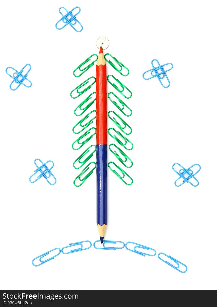 Christmas fur-tree from paper clips for a paper on a white background. Christmas fur-tree from paper clips for a paper on a white background