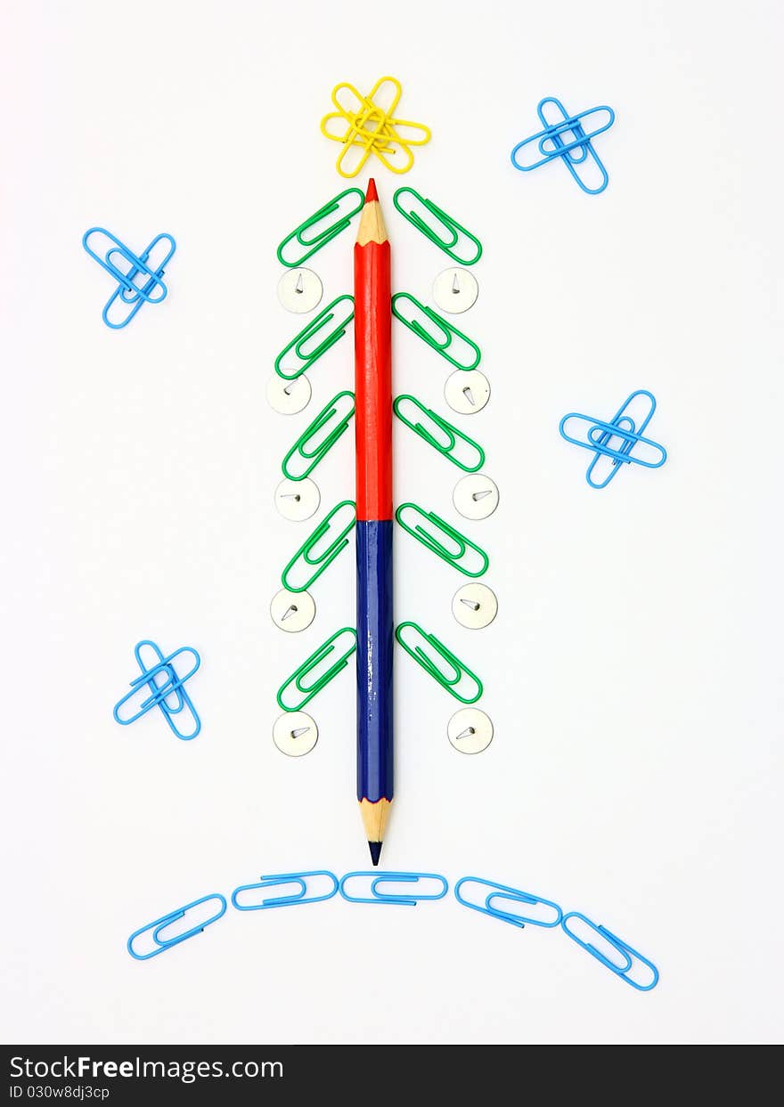 Christmas fur-tree from paper clips for a paper on a white background. Christmas fur-tree from paper clips for a paper on a white background