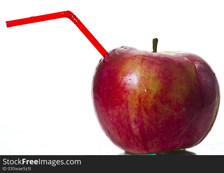 Apple with straw on white background. Apple with straw on white background