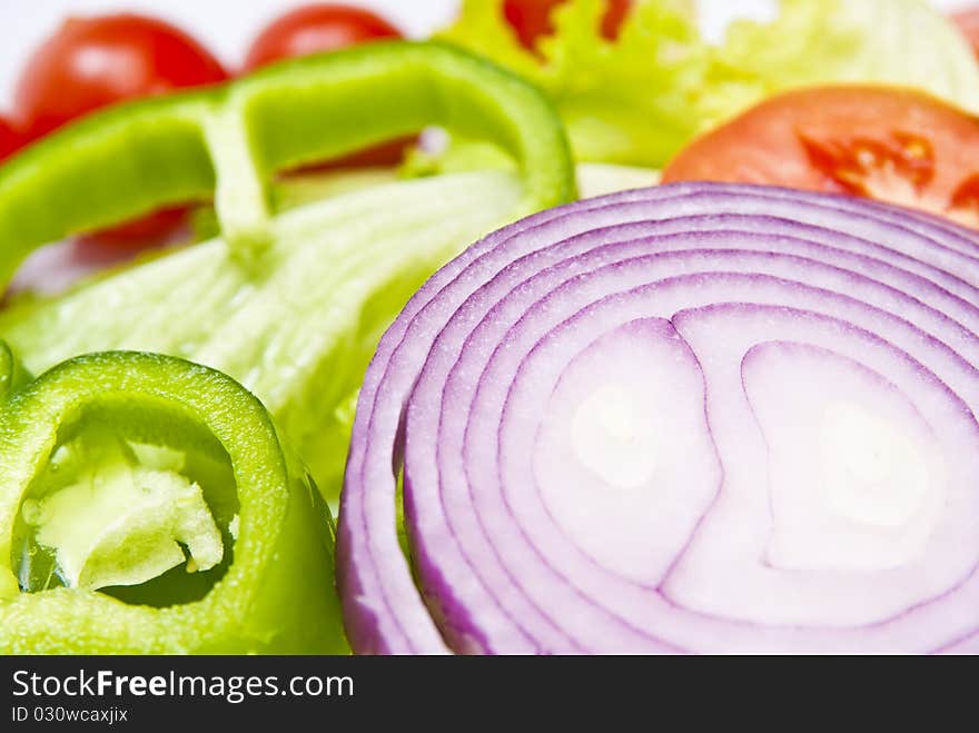 Onion falling into a salad