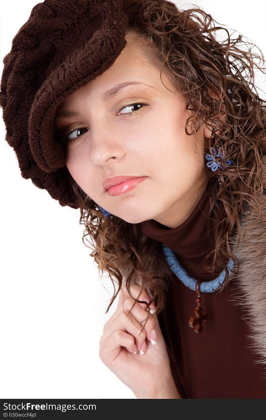 The girl in a cap on a white background