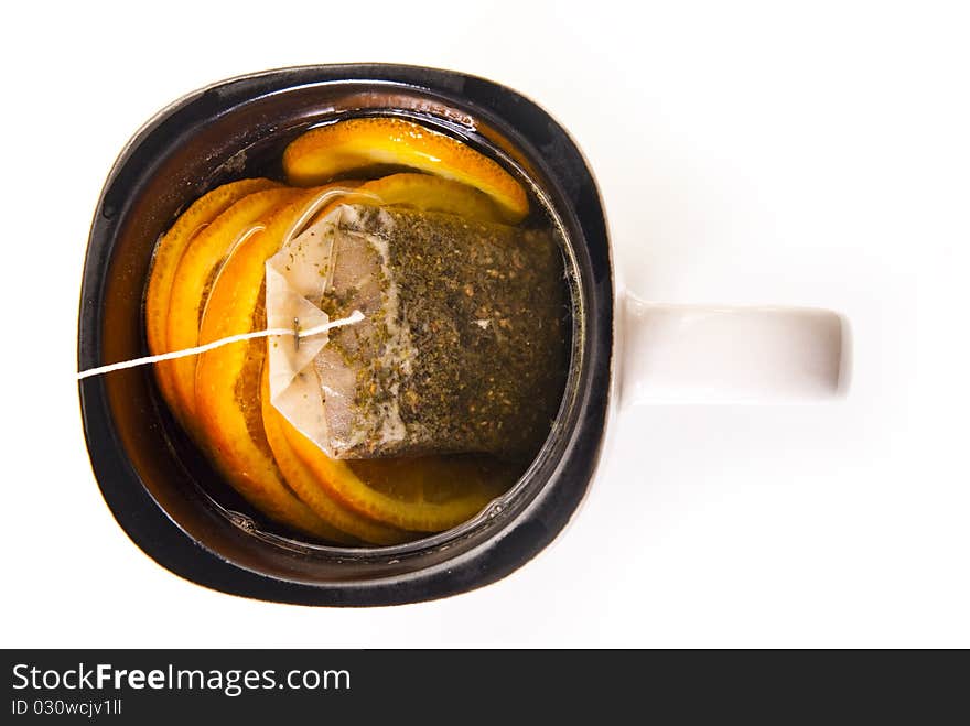 Tisane cup with orange on white background