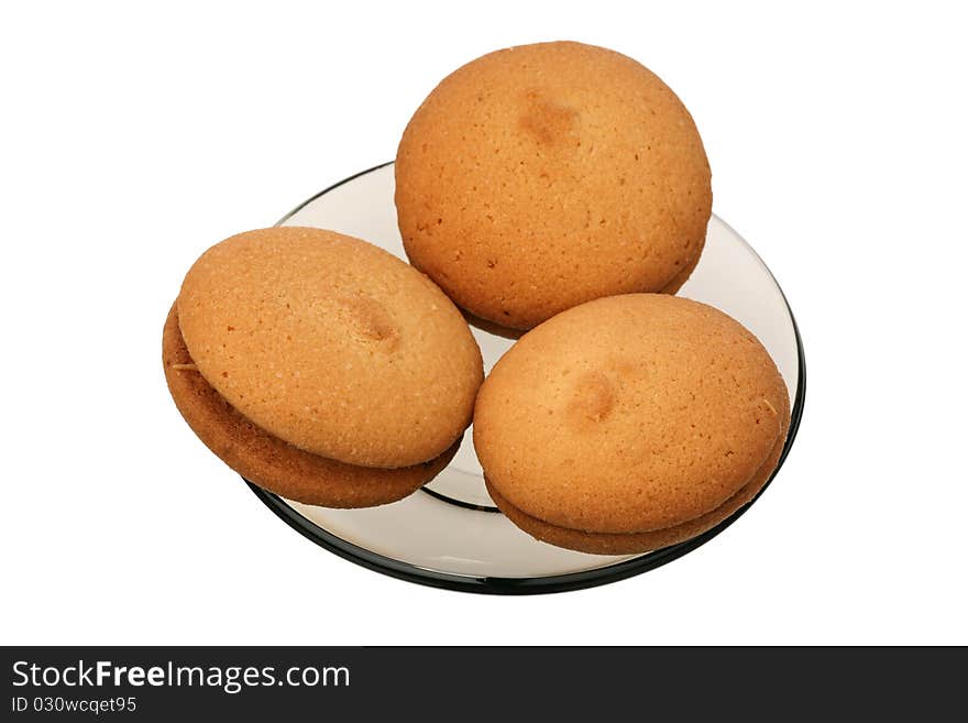 Tasty cookies on a glass plate over white background