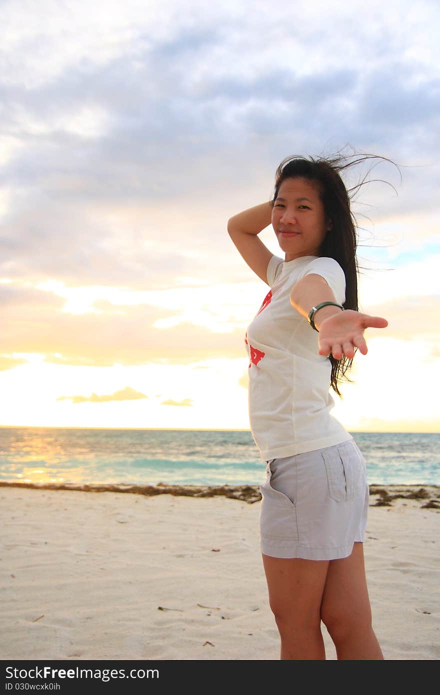 Fresh and relaxing girl on the beach.