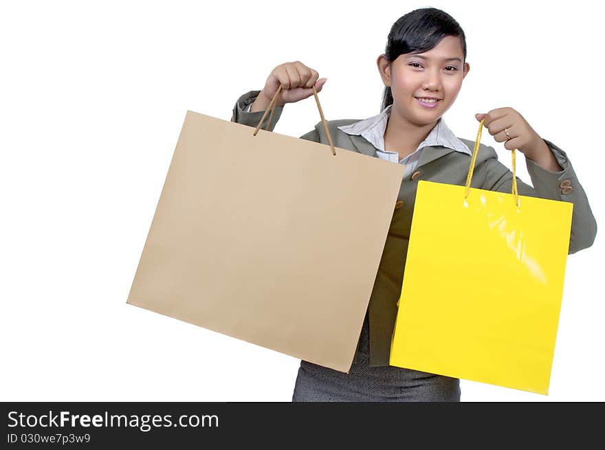 Asian woman holding shopping bag isolated over white background. Asian woman holding shopping bag isolated over white background