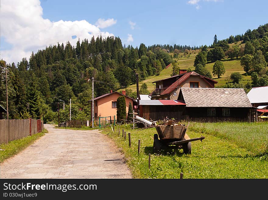 The old cart in small mountain village. The old cart in small mountain village