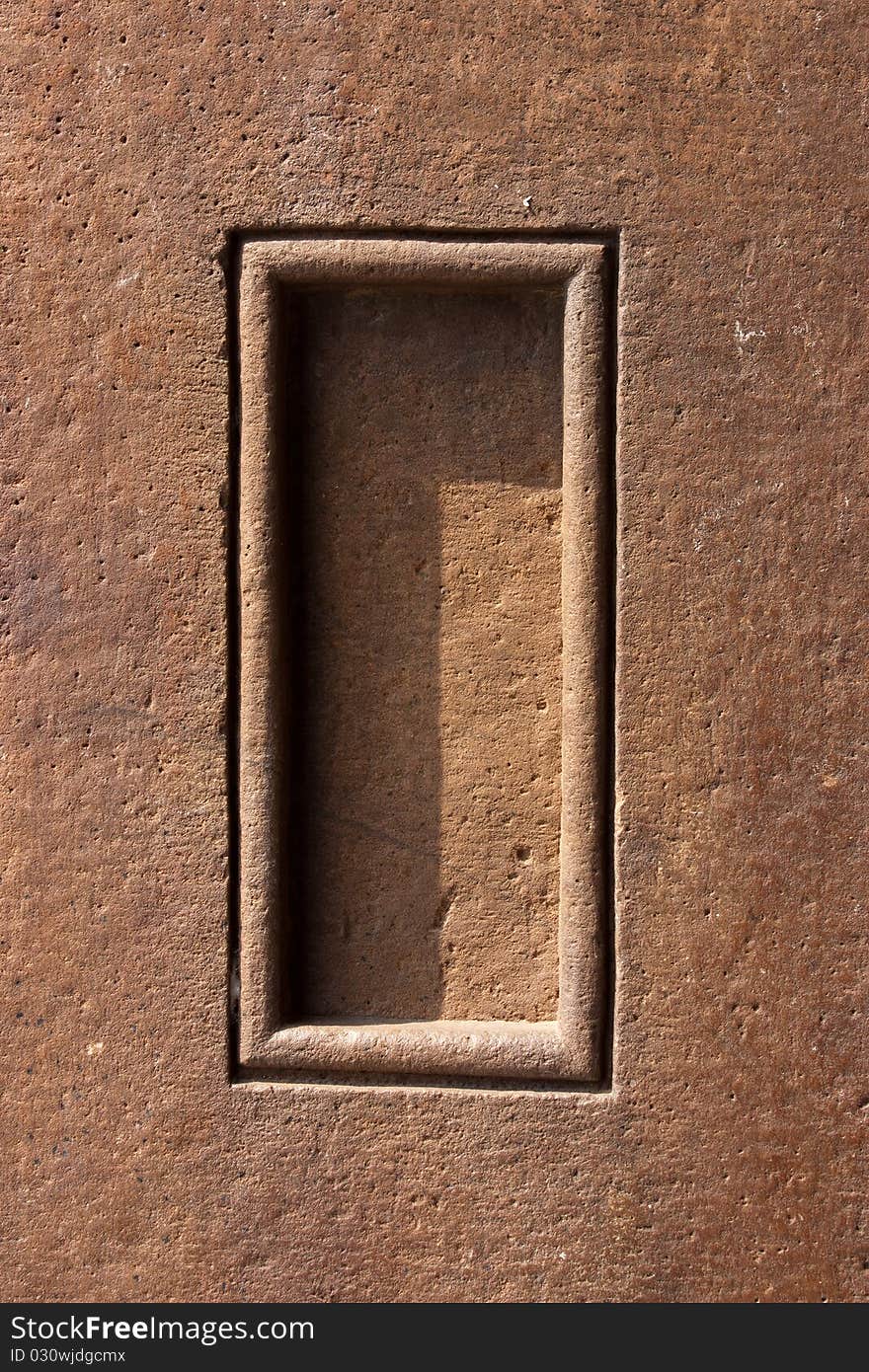 Old ornament on the decorative stone window on the wall. Old ornament on the decorative stone window on the wall