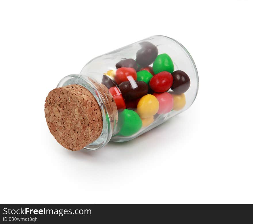 Multi-colored sweet sweets in a glass jar. Multi-colored sweet sweets in a glass jar