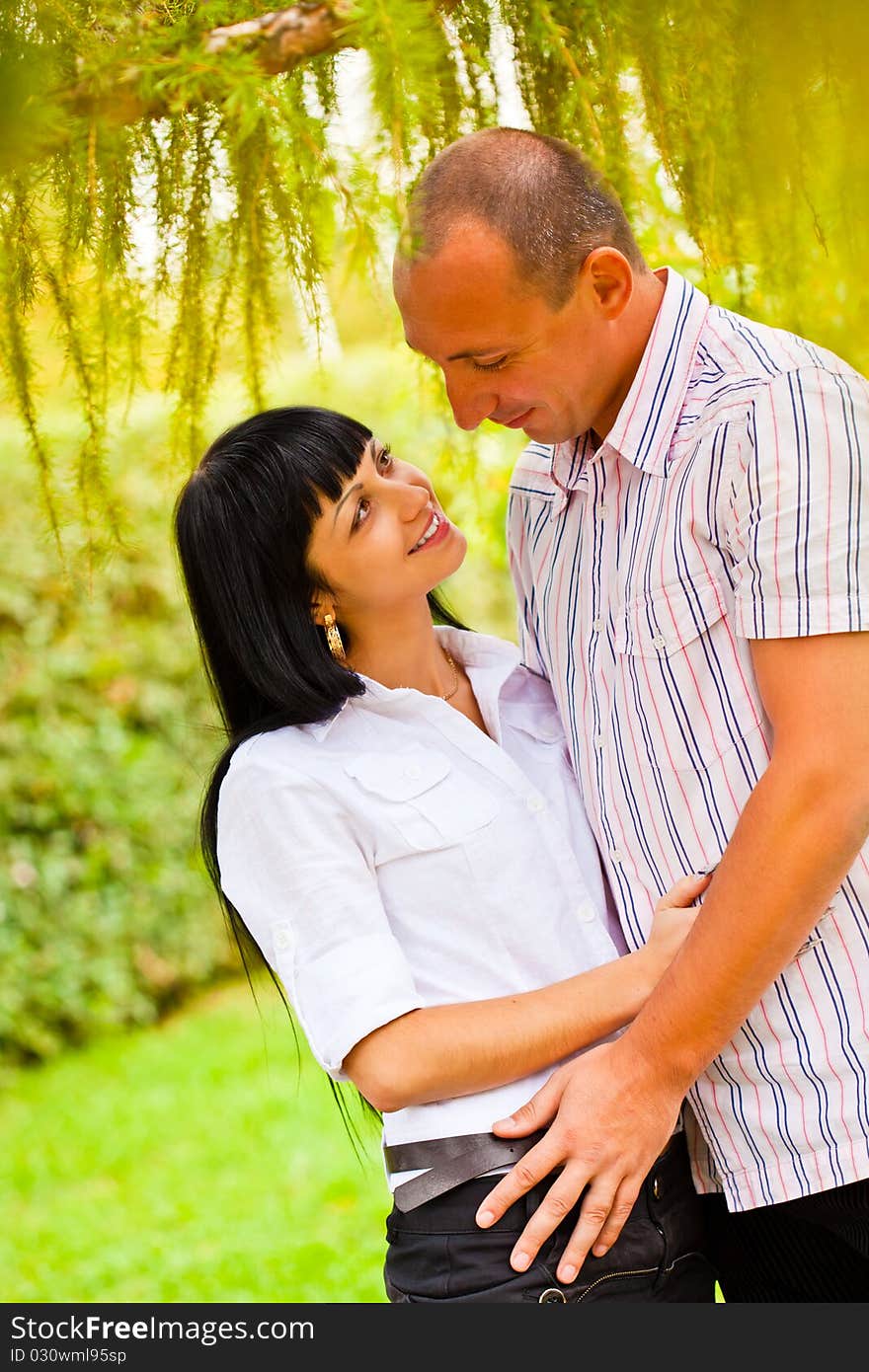 Young lovely couple in the park