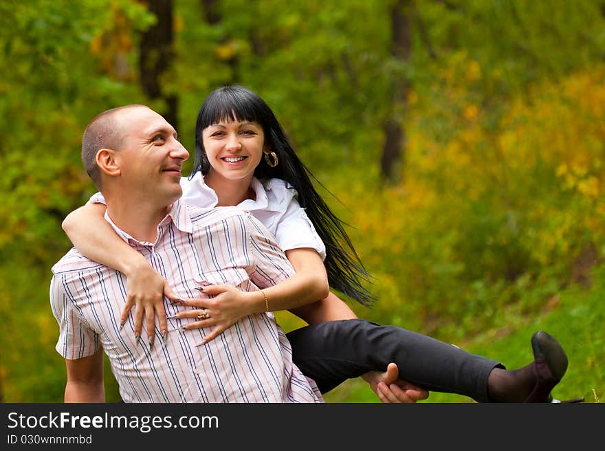 Young lovely couple have a fun in the park