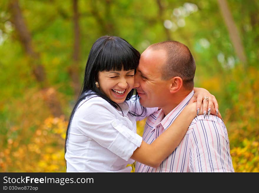 Young lovely couple in the park