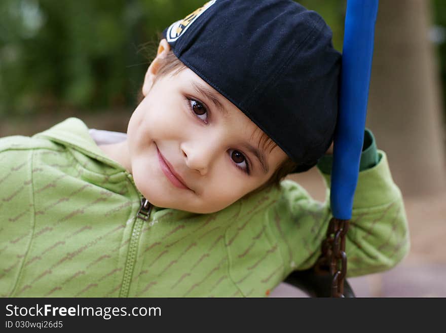 Portrait of beautiful smiling little boy in hat, outdoor shot. Portrait of beautiful smiling little boy in hat, outdoor shot