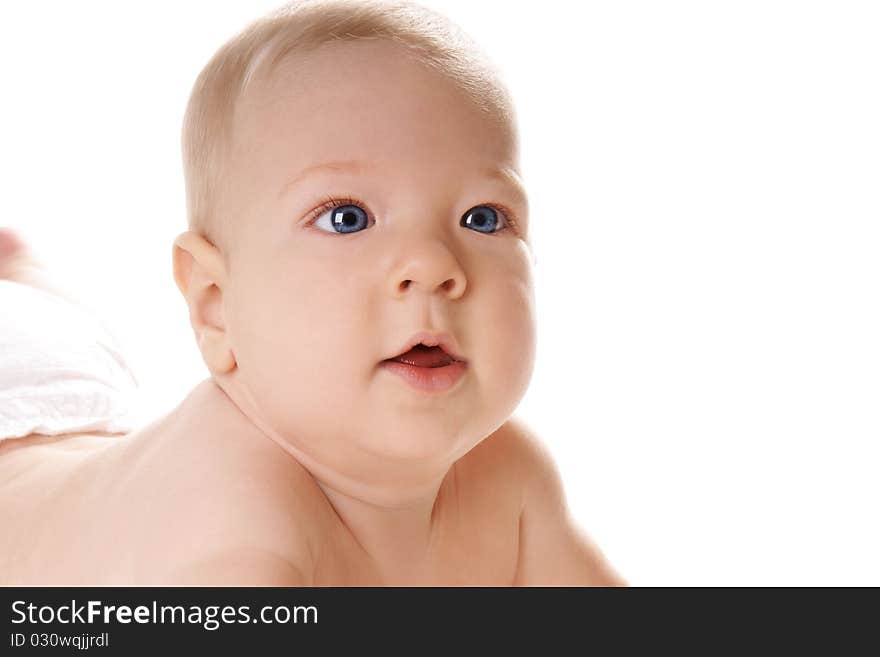 Portrait of pretty blue eyed baby boy on white background