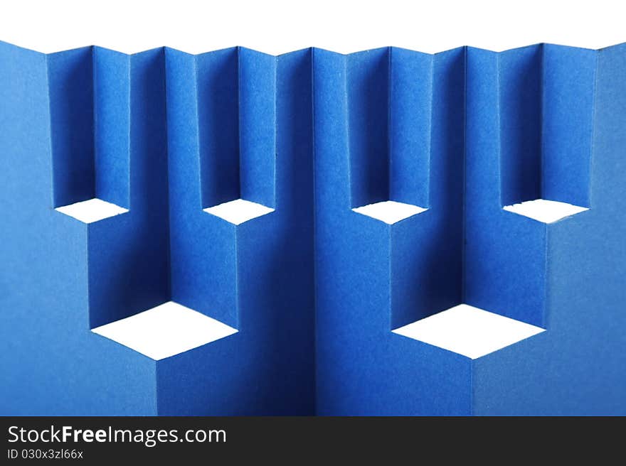 Abstract blue paper composition with cutout rhombus and zigzag. Abstract blue paper composition with cutout rhombus and zigzag