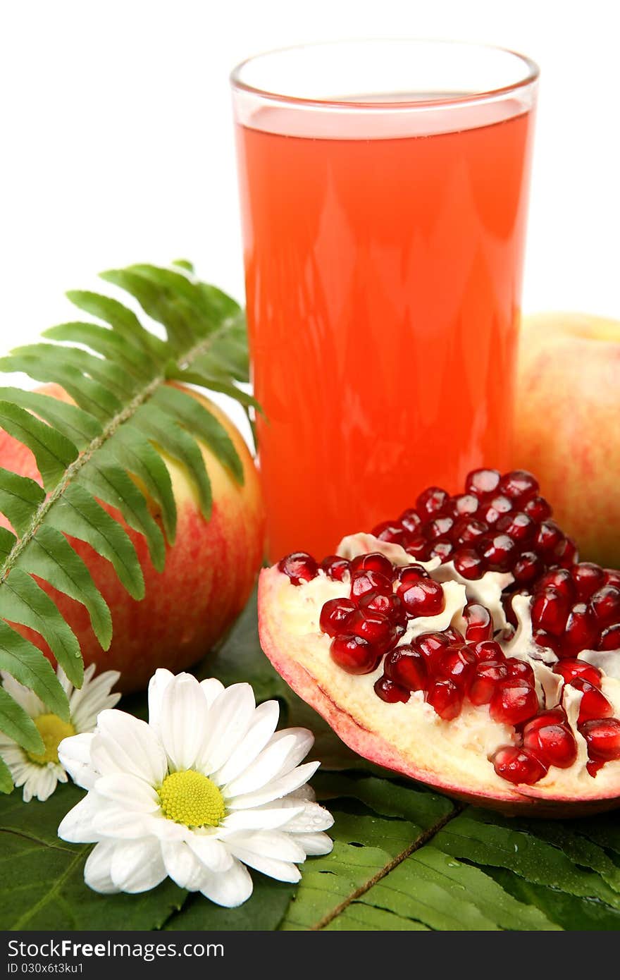 Fresh fruit and juice on a white background