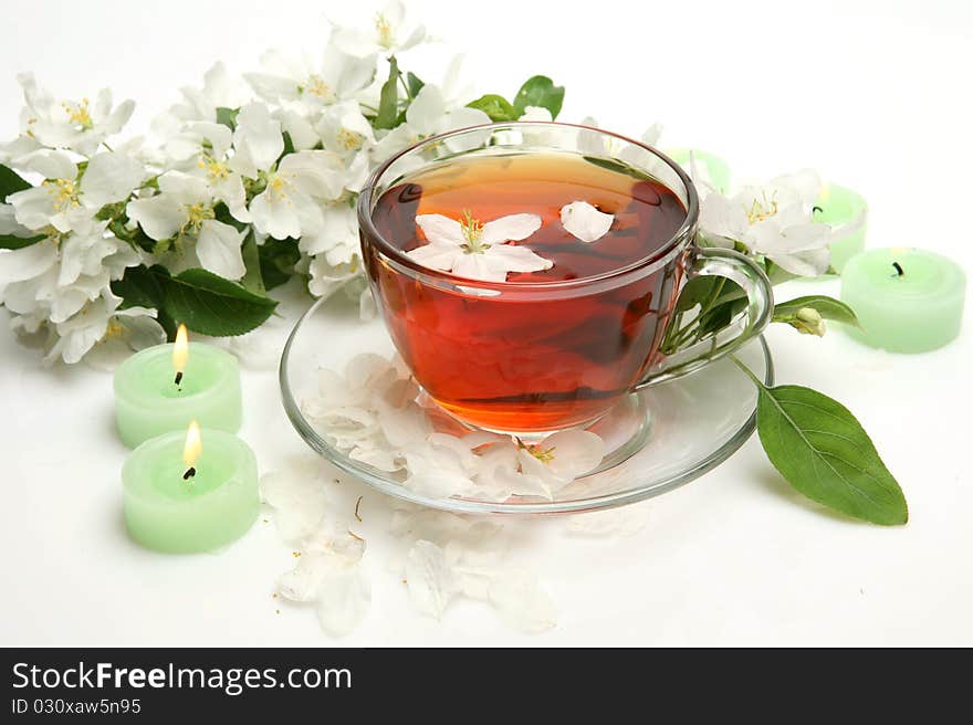 Mug with tea and flowers